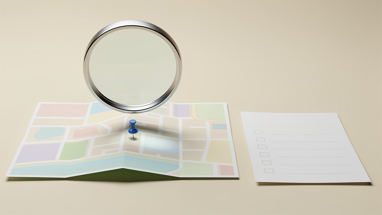 ภาพเรนเดอร์หมุด Google Maps 3 มิติกำลังถูกตรวจด้วยแว่นขยาย